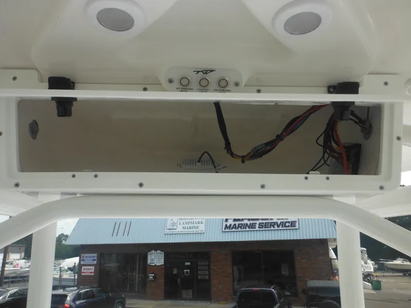 Slide: The Image of 2024 Tidewater 220 LXF boat console wiring and electronics compartment. - 40