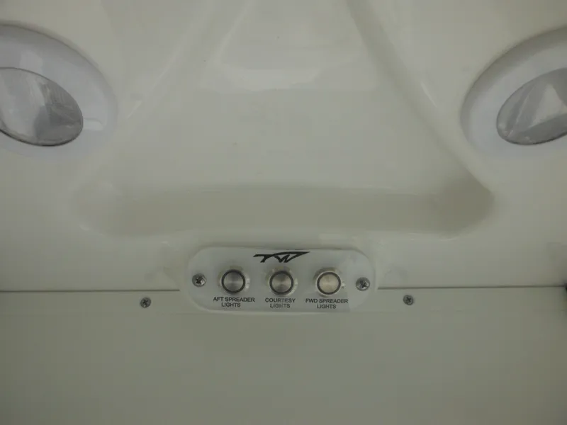 Slide: The Image of Control panel of 2024 Tidewater 220 LXF boat with light switches. - 41