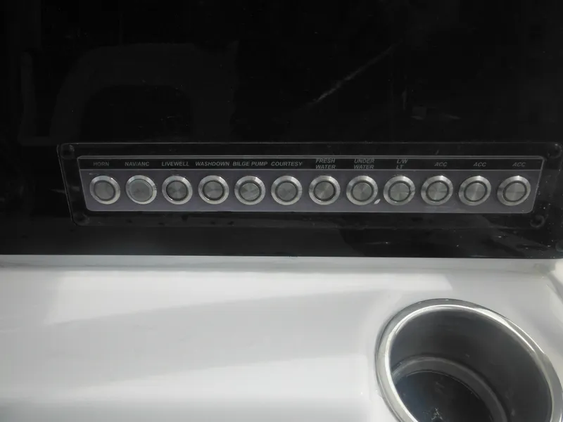 Slide: The Image of Control panel of a 2024 Tidewater 220 LXF boat with labeled switches. - 45