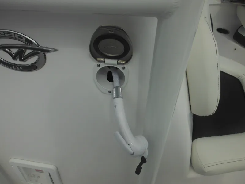 Slide: The Image of 2024 Tidewater 220 LXF boat interior detail with hose attachment. - 48