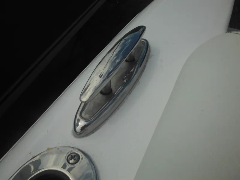 Slide: The Image of Close-up of a 2024 Tidewater 220 LXF boat's cleat and hardware. - 49