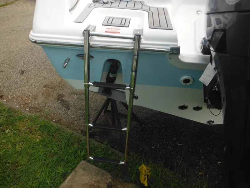 Slide: The Image of 2024 Tidewater 220 LXF boat with a stainless steel swim ladder. - 7