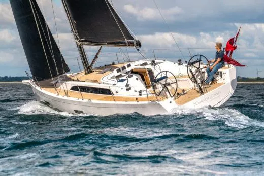 The Image of 2024 X-Yachts X4-0 sailing on open water with a person at the helm. - 0