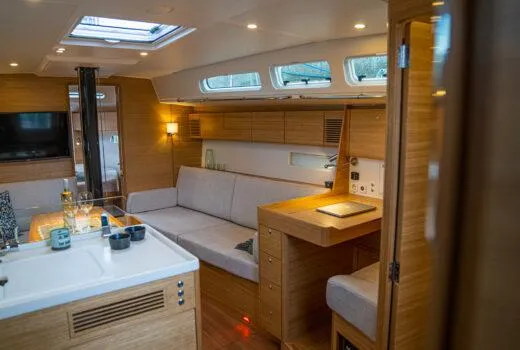 Slide: The Image of Luxurious interior of 2024 X-Yachts X4-0 sailboat with modern furnishings and ample natural light. - 12