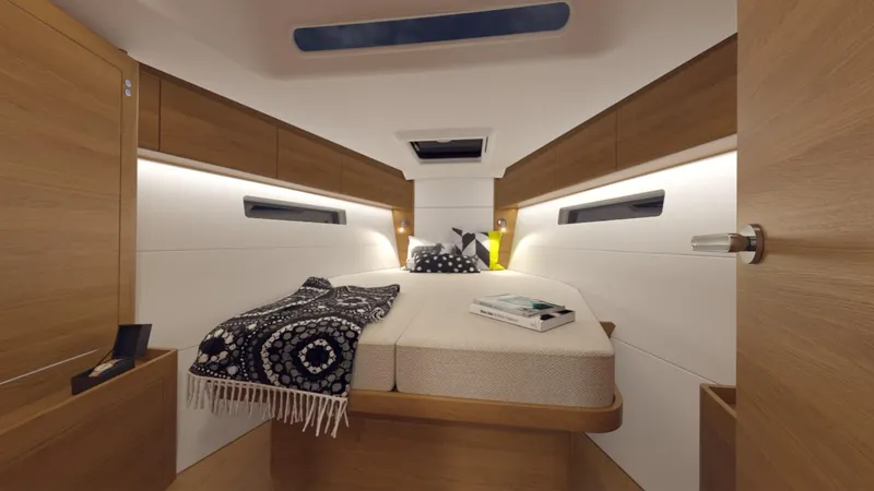 Slide: The Image of 2024 X-Yachts X4-0 cabin interior with cozy bed and modern lighting. - 18
