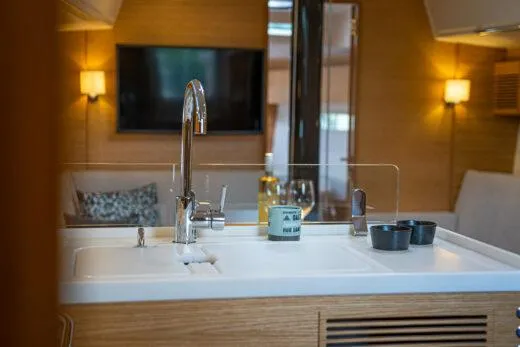 Slide: The Image of Modern kitchen area in 2024 X-Yachts X4-0 sailboat with sink and faucet. - 21