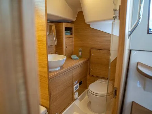 Slide: The Image of 2024 X-Yachts X4-0 yacht bathroom with wooden cabinetry and modern fixtures. - 22