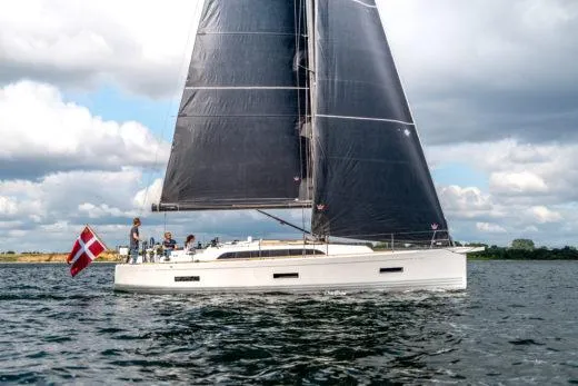 Slide: The Image of 2024 X-Yachts X4-0 sailing yacht on water with Danish flag. - 5