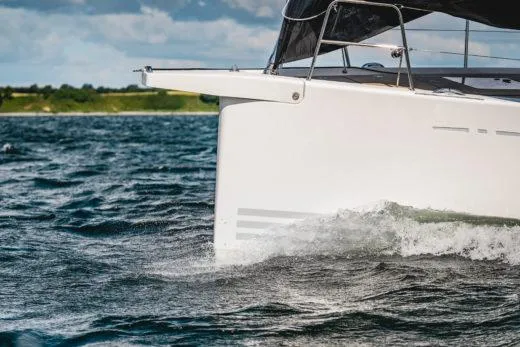 Slide: The Image of 2024 X-Yachts X4-0 sailing on open water. - 9