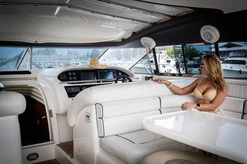 Slide: The Image of Interior of 1998 Sunseeker Predator 63 yacht with wooden cabinetry and white seating. - 19