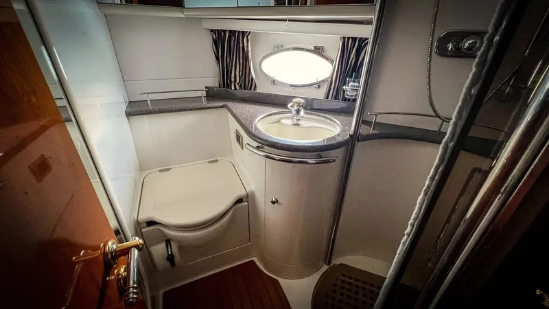 Slide: The Image of Interior of 1998 Sunseeker Predator 63 yacht with wooden furnishings and cozy seating area. - 20