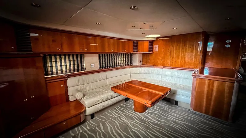 Slide: The Image of Luxurious interior of 1998 Sunseeker Predator 63 yacht with wooden finishes and leather seating. - 24