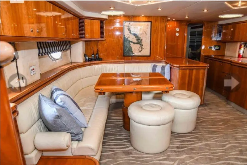 Slide: The Image of Luxurious interior of 1998 Sunseeker Predator 63 yacht with wooden finishes and plush seating. - 25