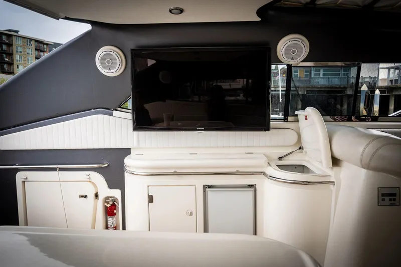 Slide: The Image of Interior of 1998 Sunseeker Predator 63 yacht with TV and storage cabinets. - 26