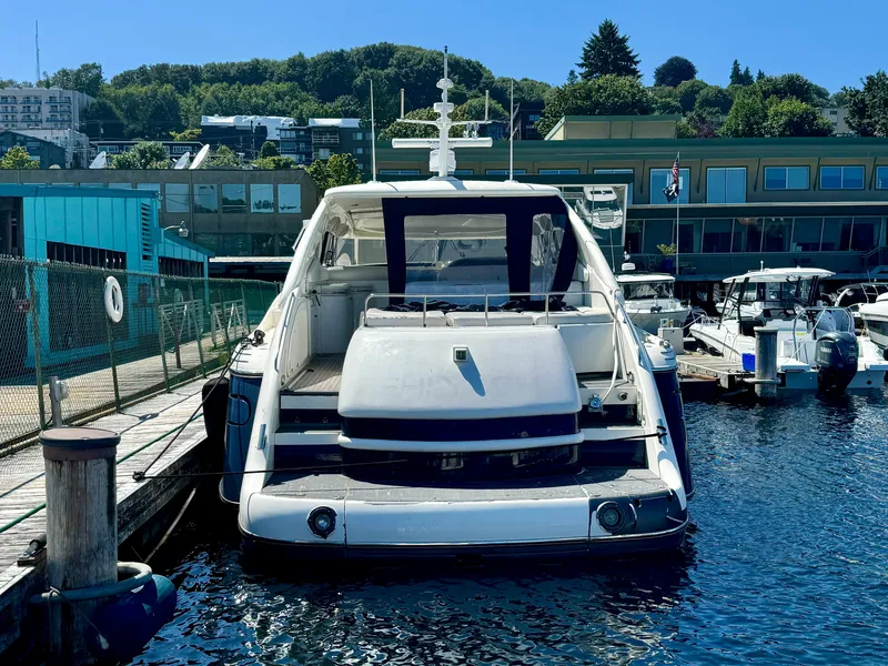Slide: The Image of 1998 Sunseeker Predator 63 yacht docked at marina, side view. - 6