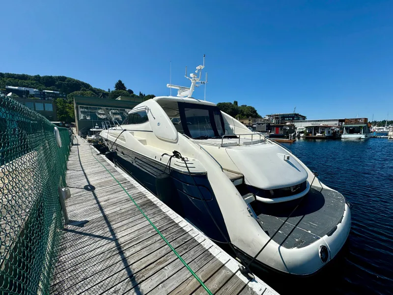 Slide: The Image of Woman relaxing on a 1998 Sunseeker Predator 63 yacht, wearing a sun hat and sunglasses. - 9