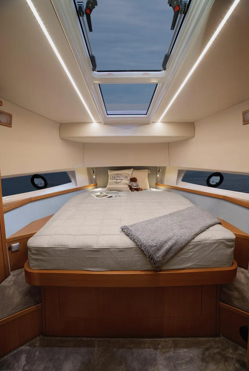 Slide: The Image of Luxurious bedroom interior of 2025 Sargo 45 Cat A yacht with skylight and cozy bedding. - 14