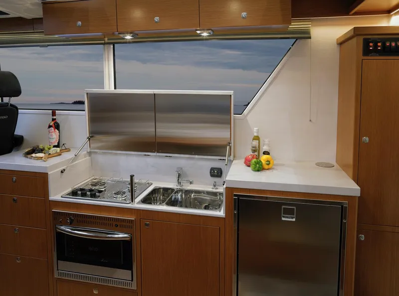 Slide: The Image of Luxurious interior of 2025 Sargo 45 Cat A boat with leather seating and dining area. - 23