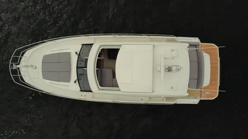 Slide: The Image of Top view of 2024 Prestige 420S luxury yacht on dark water. - 11