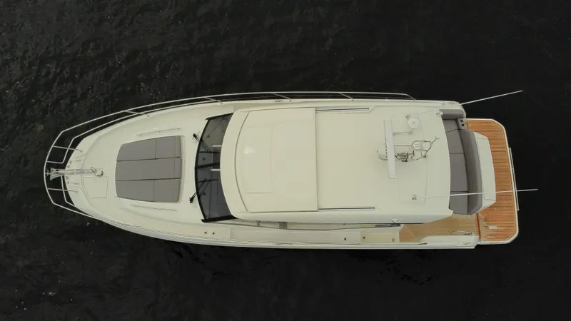 Slide: The Image of Aerial view of 2024 Prestige 420S yacht on dark water. - 12