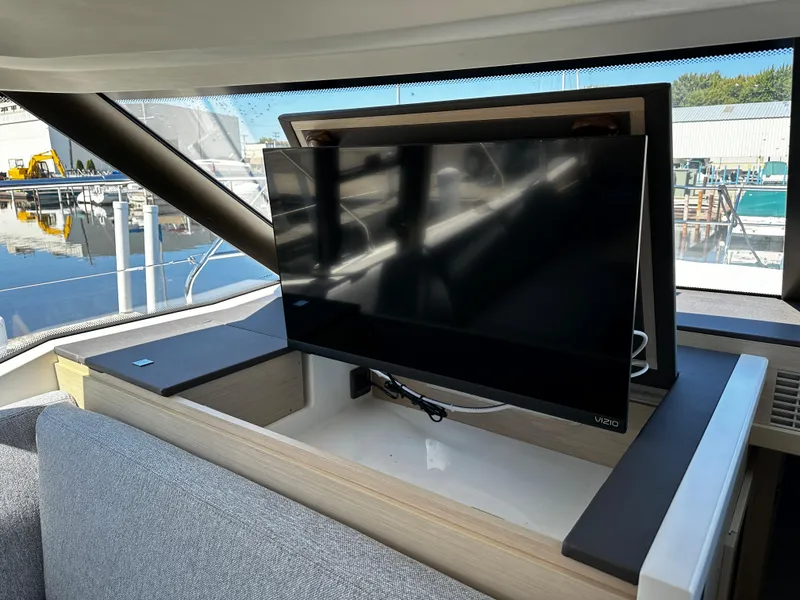 Slide: The Image of 2024 Prestige 420S yacht interior with retractable TV. - 31