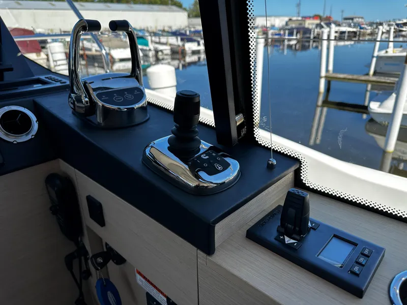 Slide: The Image of Control panel of a 2024 Prestige 420S yacht at a marina. - 34