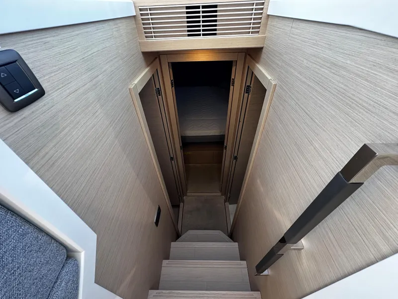 Slide: The Image of 2024 Prestige 420S yacht interior staircase leading to cabin area. - 36