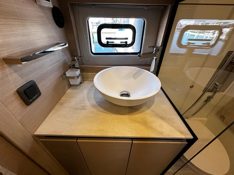 Slide: The Image of 2024 Prestige 420S yacht bathroom with modern sink and window. - 40