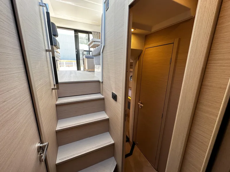 Slide: The Image of Interior stairs of 2024 Prestige 420S yacht leading to upper deck. - 41