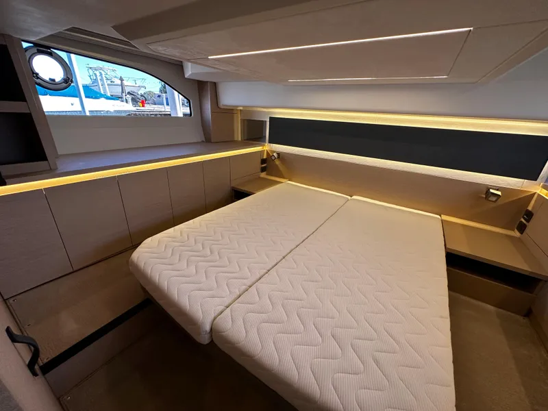 Slide: The Image of 2024 Prestige 420S yacht interior cabin with modern lighting and comfortable bedding. - 44