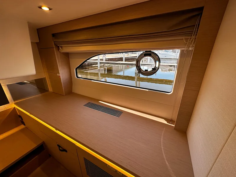 Slide: The Image of Interior cabin of 2024 Prestige 420S yacht with window view. - 45