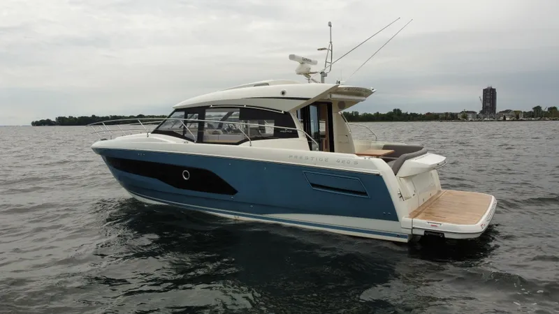 Slide: The Image of 2024 Prestige 420S luxury yacht on open water. - 6