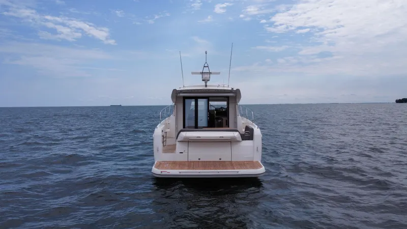 Slide: The Image of Prestige 420S 2024 yacht on open water, rear view. - 8