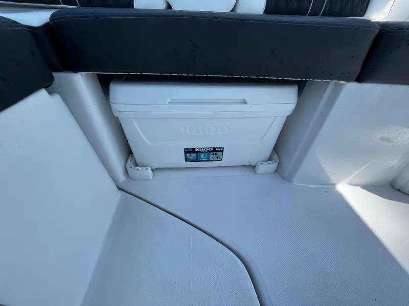 Slide: The Image of 2024 Monterey M-65 boat interior with built-in Igloo cooler. - 12