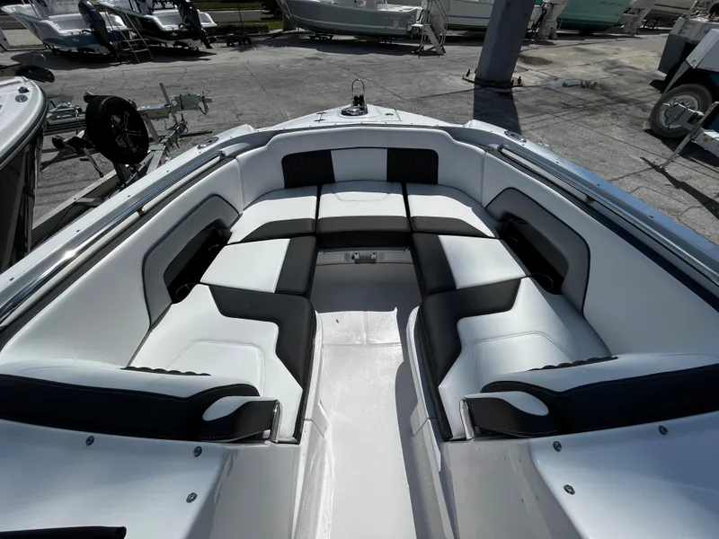 Slide: The Image of 2024 Monterey M-65 boat with spacious seating area and modern design. - 19