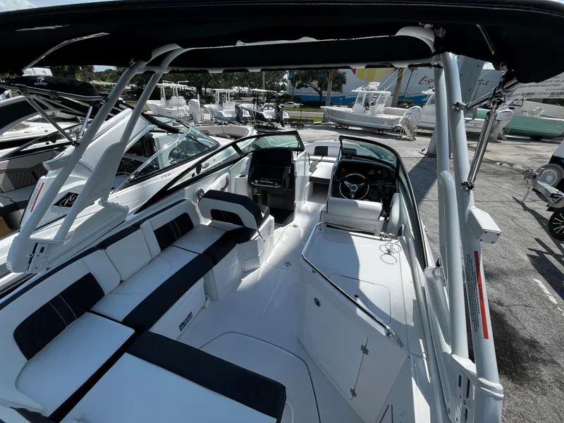 Slide: The Image of 2024 Monterey M-65 boat interior with seating and helm station. - 24