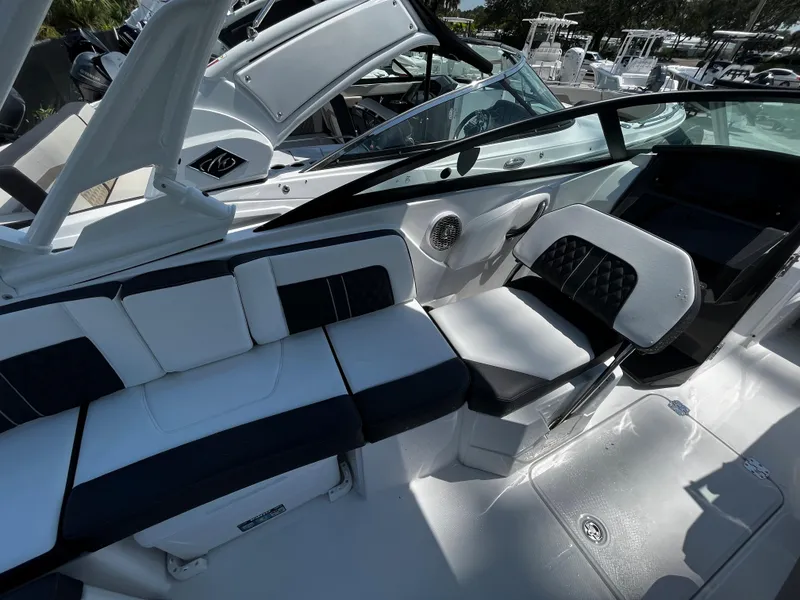 Slide: The Image of 2024 Monterey M-65 boat interior with white and black seating. - 9