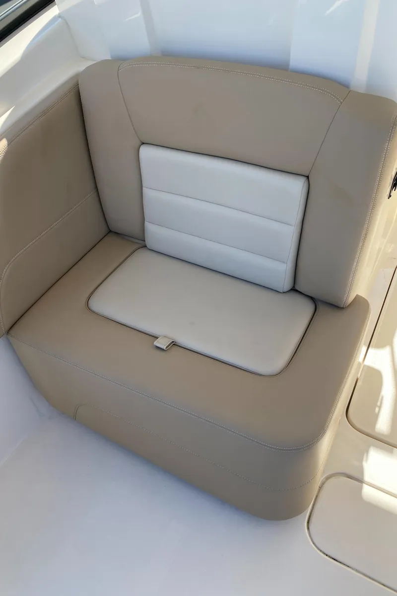 Slide: The Image of 2022 Scout 255 Dorado boat seat, beige and white upholstery. - 12