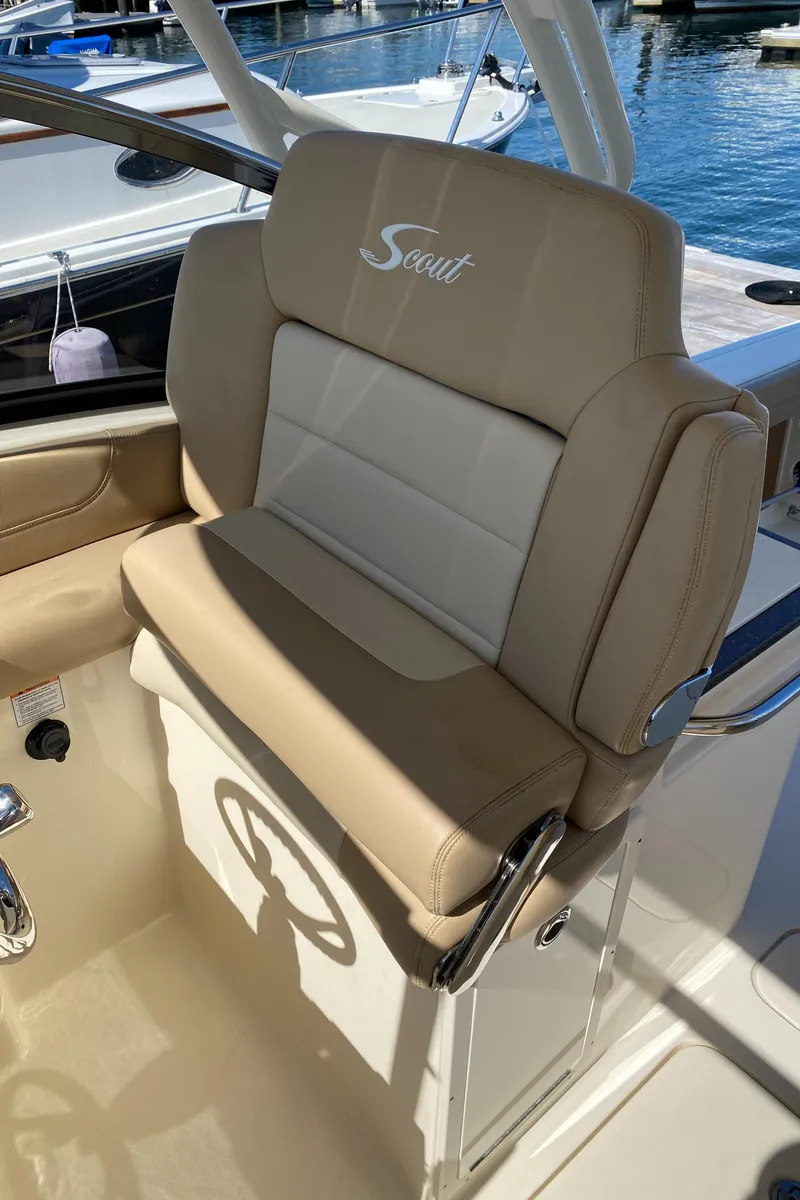 Slide: The Image of 2022 Scout 255 Dorado boat seat with beige and white upholstery. - 14