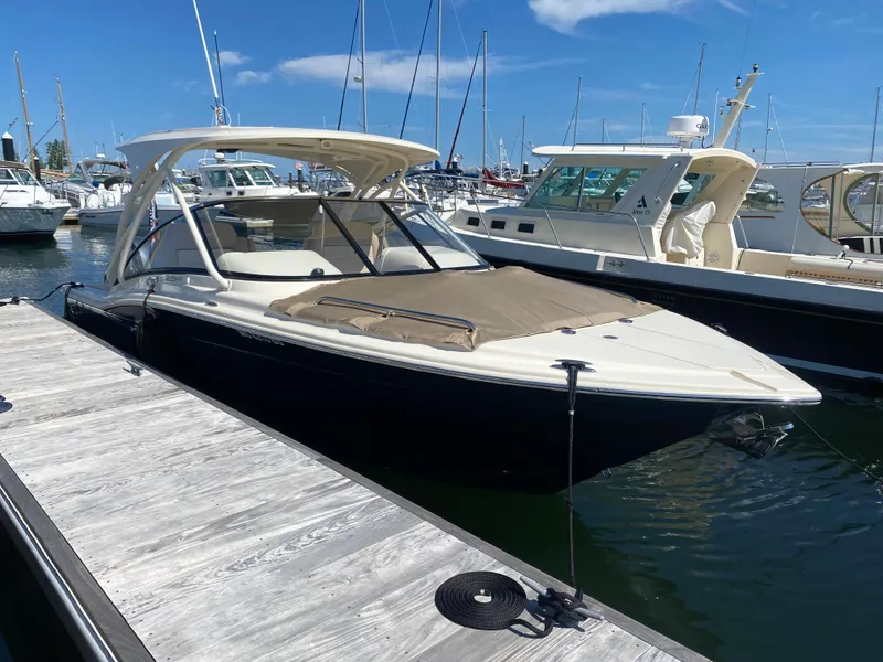 Slide: The Image of 2022 Scout 255 Dorado boat docked at marina on a sunny day. - 3
