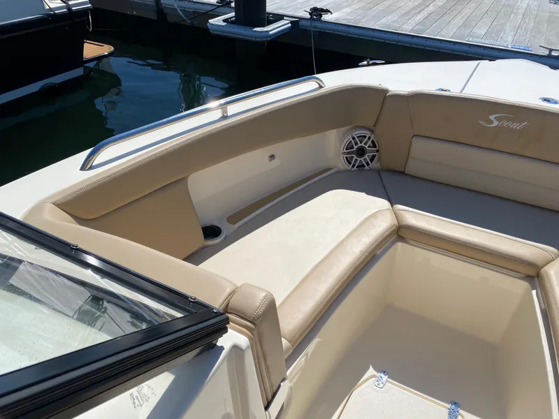Slide: The Image of 2022 Scout 255 Dorado boat interior with beige seating and speaker. - 9