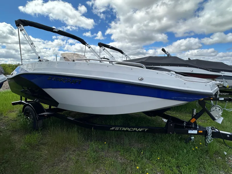 The Image of 2024 Starcraft SVX171 boat on trailer under cloudy sky. - 0