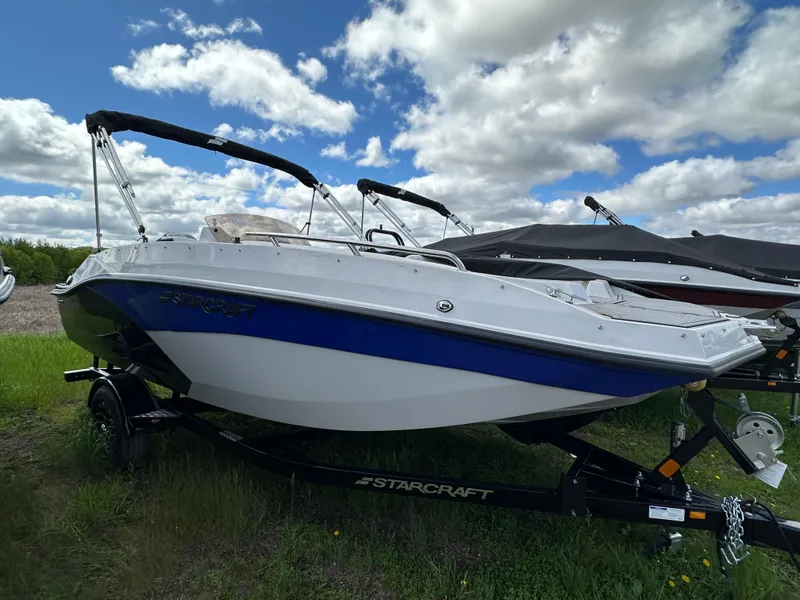 Slide: The Image of 2024 Starcraft SVX171 boat on a trailer under a partly cloudy sky. - 8