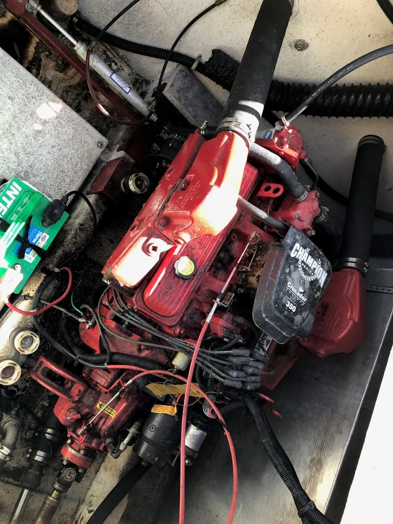 Slide: The Image of 1993 Gibson 37 Sport Series engine compartment with red engine and wiring. - 21