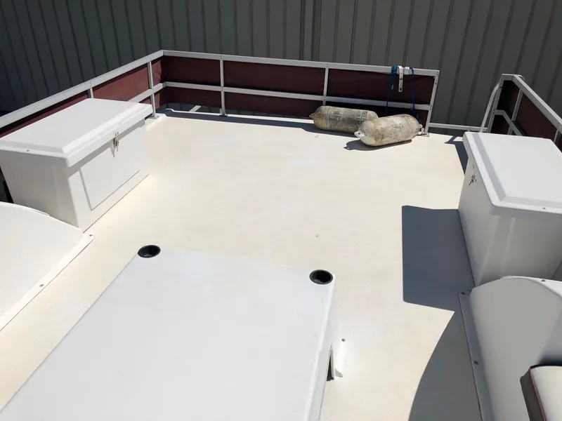 Slide: The Image of 1993 Gibson 37 Sport Series boat deck with storage compartments. - 6