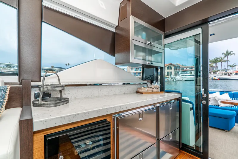 Slide: The Image of Interior of 2017 Tiara Yachts C53 Coupe with modern kitchen. - 17