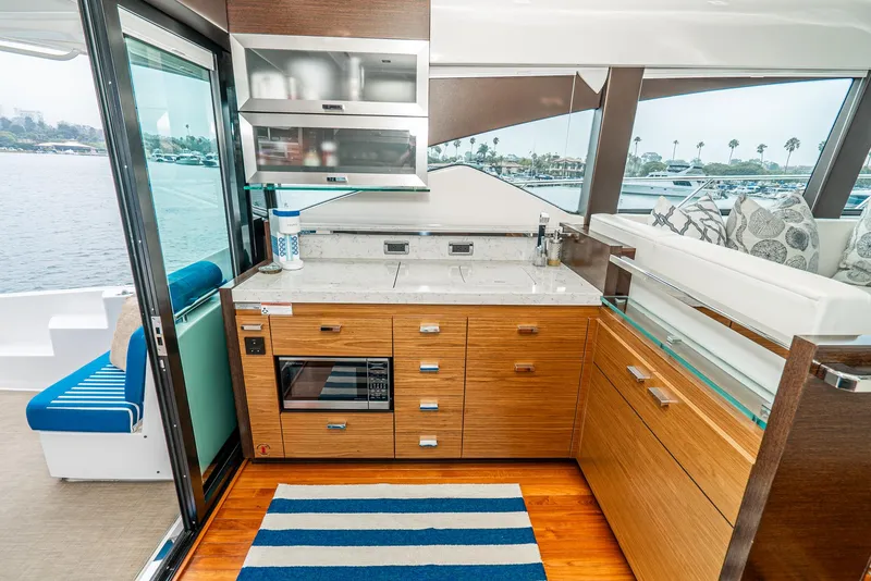 Slide: The Image of Interior of 2017 Tiara Yachts C53 Coupe with modern kitchen. - 19