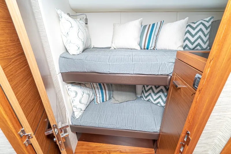 Slide: The Image of Interior of 2017 Tiara Yachts C53 Coupe with bunk beds. - 21