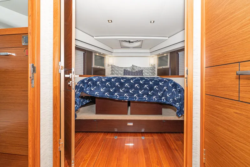 Slide: The Image of Interior of 2017 Tiara Yachts C53 Coupe featuring a luxurious bedroom. - 27