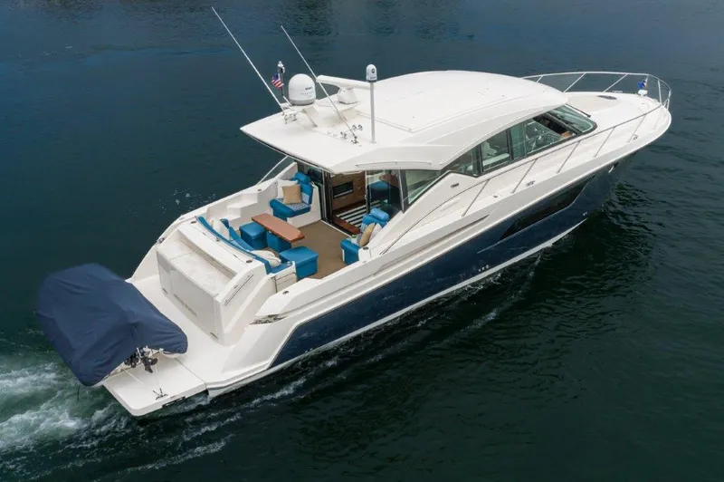 Slide: The Image of 2017 Tiara Yachts C53 Coupe cruising on calm waters. - 3